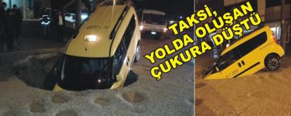 TAKS�, YOLDA OLU�AN �UKURA D��T�