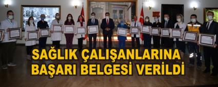 SA�LIK �ALI�ANLARINA BA�ARI BELGES� VER�LD�