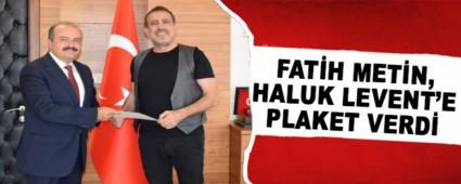 FAT�H MET�N, HALUK LEVENT\'E PLAKET VERD�
