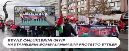 Beyaz �nl�klerini giyip hastanelerin bombalanmas�n� protesto ettiler
